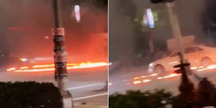 Autos realizan maniobras alrededor de un anillo de fuego en Miami